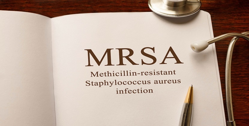 gdmeds news about MRSA (Methicillin-resistant Staphylococcus aureus infection) on the table with stethoscope, medical concept